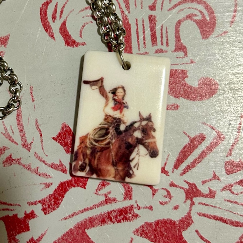 Vintage celluloid pendant necklace with cowgirl and horse